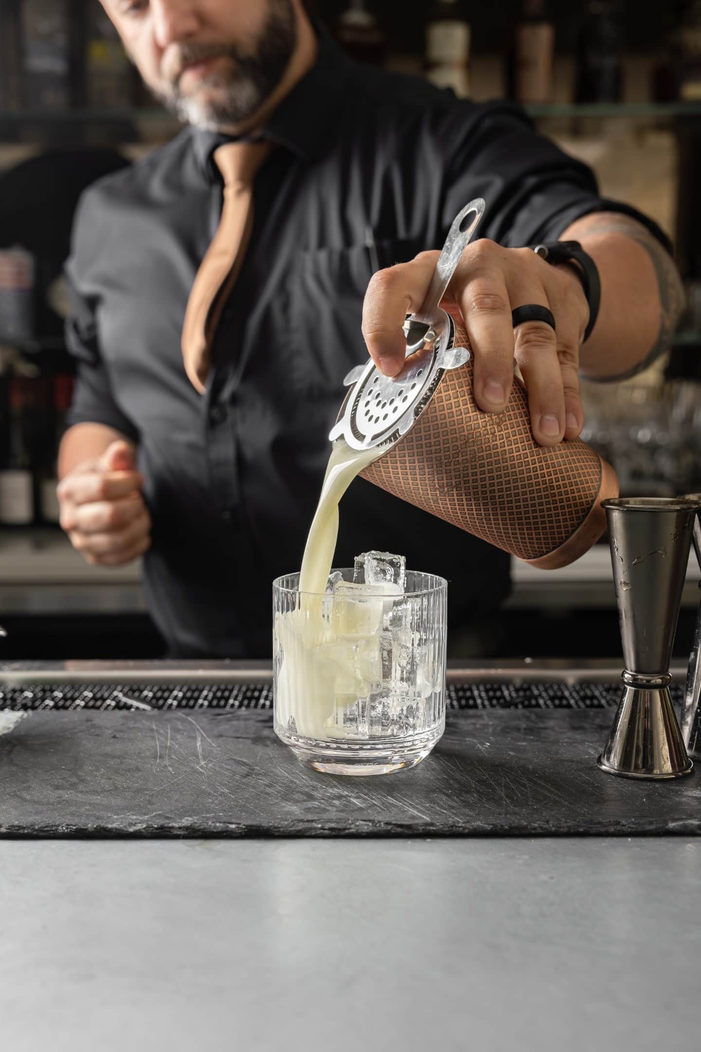 A bartender pouring at L'Étoile
